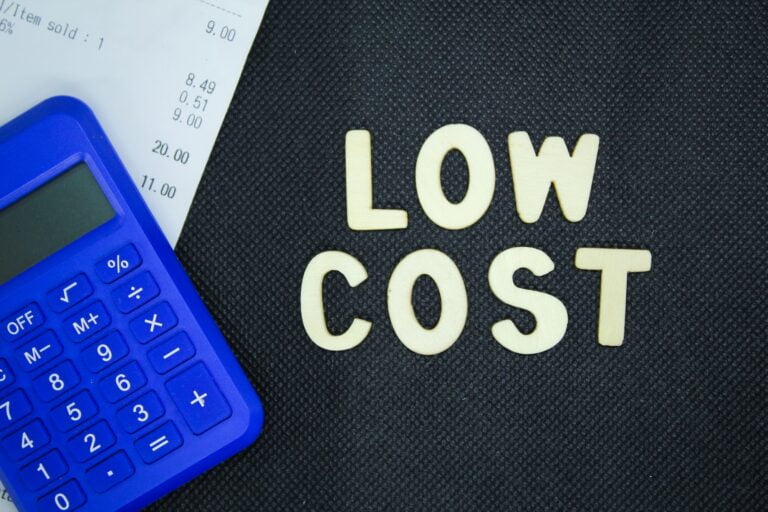 calculator and receipt with the word low cost.